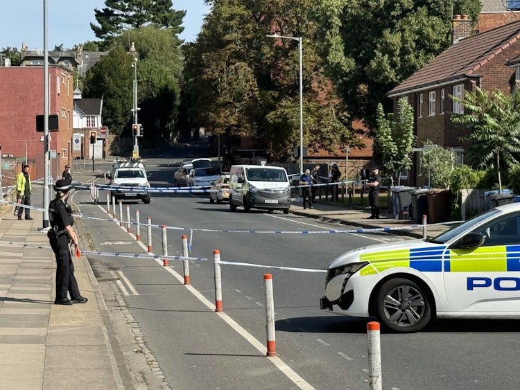 Police remain at the scene of the suspected arson attack on Portman Road